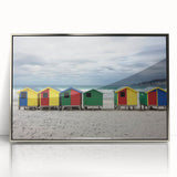 Framed acrylic artwork showcasing a serene beach landscape with vibrant blue skies and soft sandy shores, elegantly displayed in a silver frame.