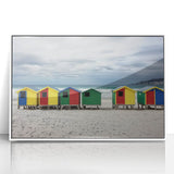 Framed acrylic artwork depicting a serene beach landscape with soft blue skies and gentle waves, set in a sleek white frame, perfect for home decor.
