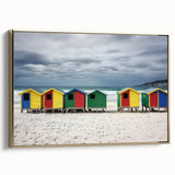 Framed canvas artwork depicting a serene beach landscape with golden hues, showcasing gentle waves and a tranquil sky, perfect for coastal home decor.