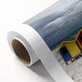 Vibrant rolled canvas showcasing a serene beach landscape with soft waves and golden sands, elegantly packaged in a protective cardboard tube for safe shipping.
