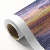 Rolled canvas print showcasing a vibrant landscape bridge design, featuring rich colors and intricate details, packaged securely in a protective cardboard tube.