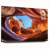 Landscape acrylic artwork depicting vibrant canyons in rich earth tones, displayed in a sleek glass frame, showcasing intricate details and textures with mounting pins.