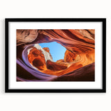 Landscape artwork of majestic canyons framed in a sleek black mat, showcasing intricate details and vibrant colors, perfect for home decor or office settings.