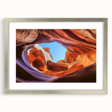 Silver-framed landscape artwork depicting stunning canyons, mounted with a mat. Ideal for home decor, enhancing living spaces with natural beauty and elegance.