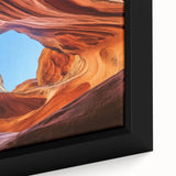 Close-up of a framed canvas depicting a vibrant landscape of canyons, showcasing rich earthy tones and intricate textures, perfect for home decor.