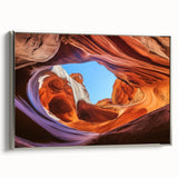 Framed canvas artwork depicting a stunning landscape of canyons, showcasing rich earth tones and intricate textures, with a sleek silver frame accentuating its beauty. Perfect for home decor enthusiasts seeking nature-inspired art.