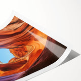 Stunning landscape print showcasing vibrant canyons in rich hues of red and orange, elegantly rolled and ready for display in a protective cardboard tube.