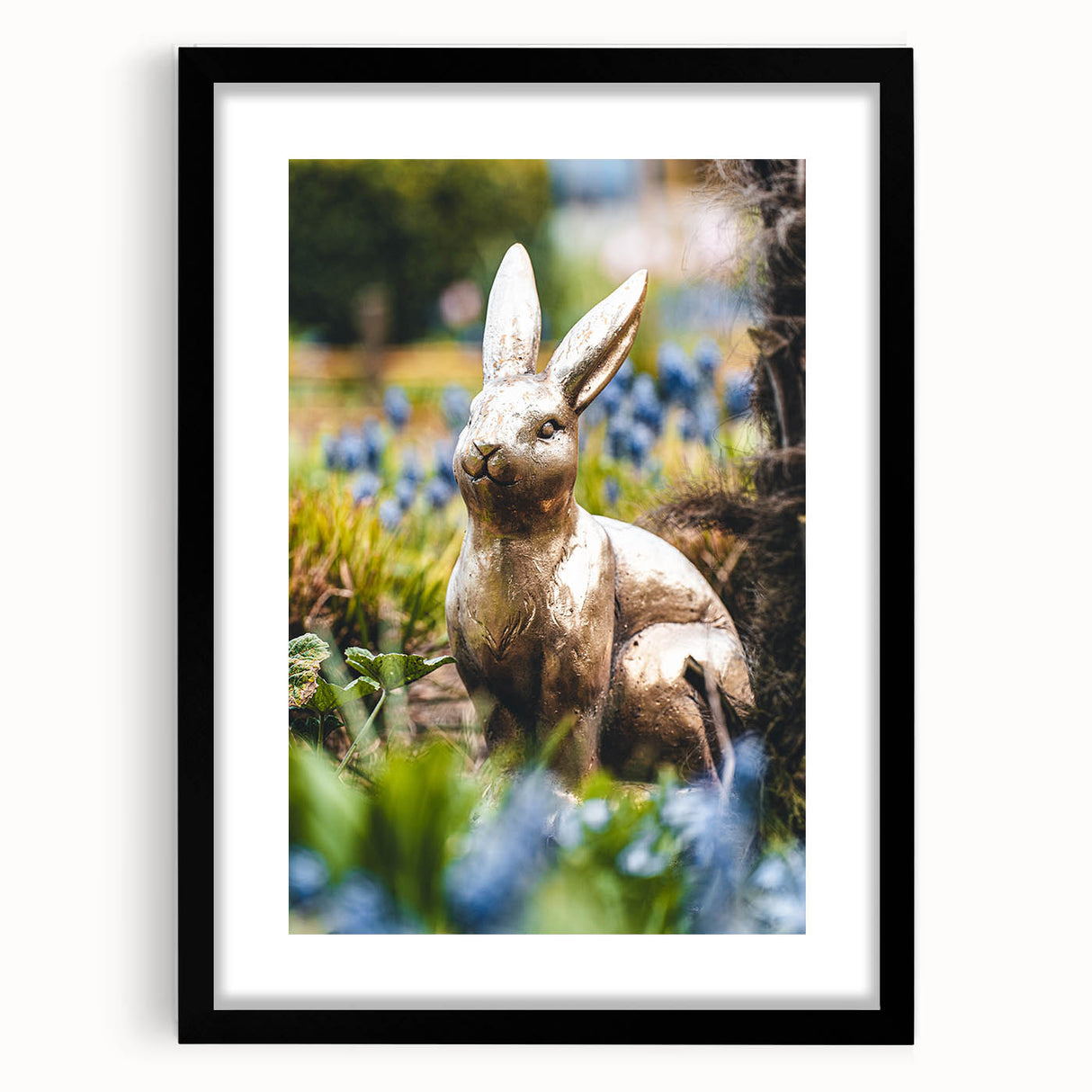 Abstract art print featuring vibrant spring colors on a textured canvas, framed in black, ideal for living room decor.