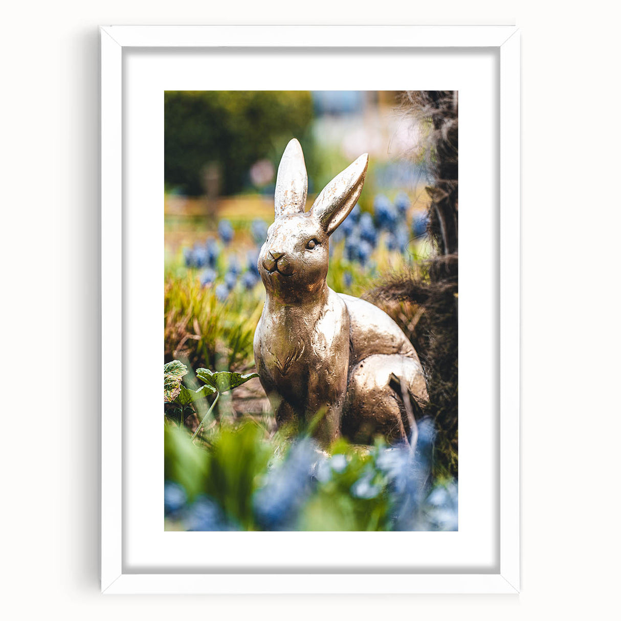 Abstract art print of spring-themed design in soft pastel colors, framed with white mat.