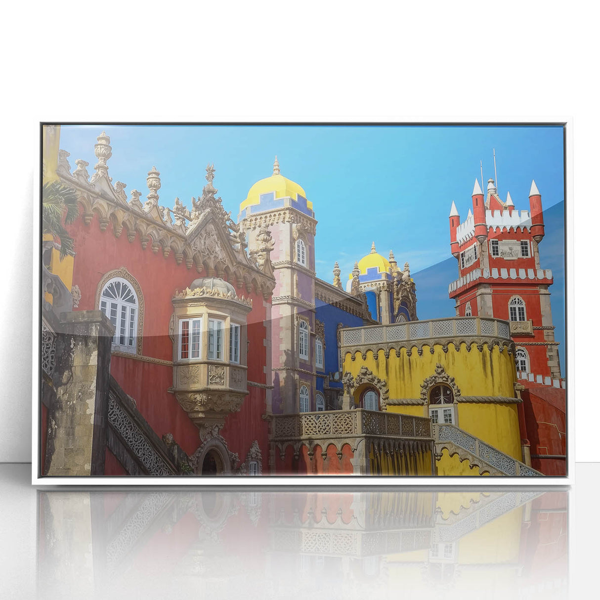 Framed acrylic artwork depicting a serene landscape with a majestic castle set against a vibrant blue sky, showcasing intricate details and vivid colors. This piece adds a touch of elegance to any home décor.