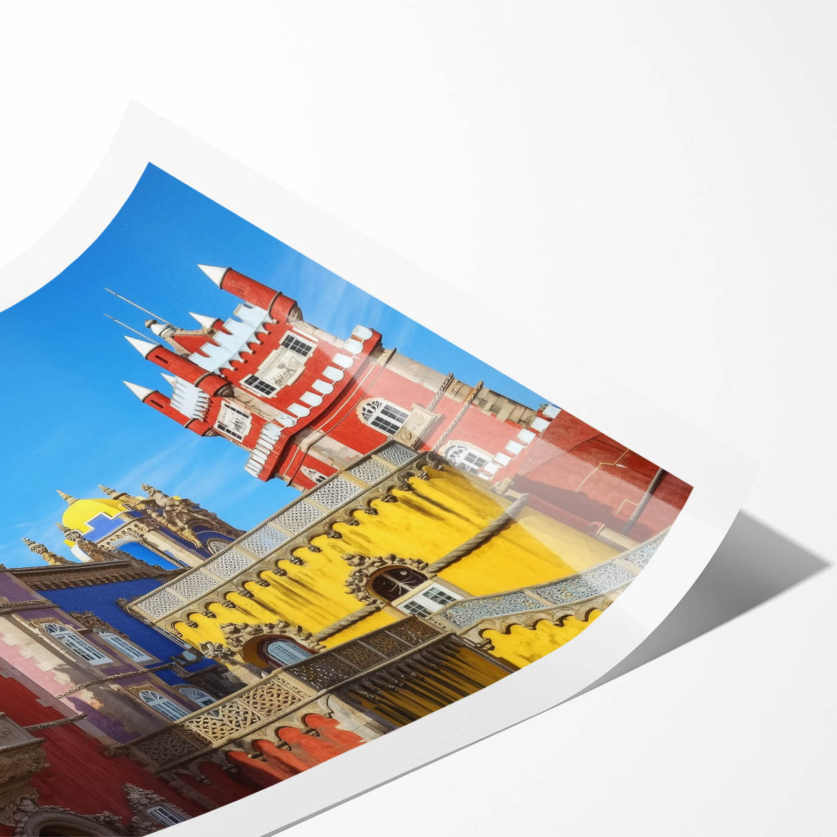 Beautifully detailed rolled print of a serene landscape featuring a majestic castle surrounded by lush greenery and a clear blue sky, perfect for home decor.