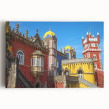 Stretched canvas artwork depicting a scenic landscape of a majestic castle surrounded by lush greenery and a clear blue sky, perfect for home decor.