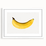 Abstract art print featuring assorted fruits in vibrant colors on a white framed mat, suitable for dining room decor.