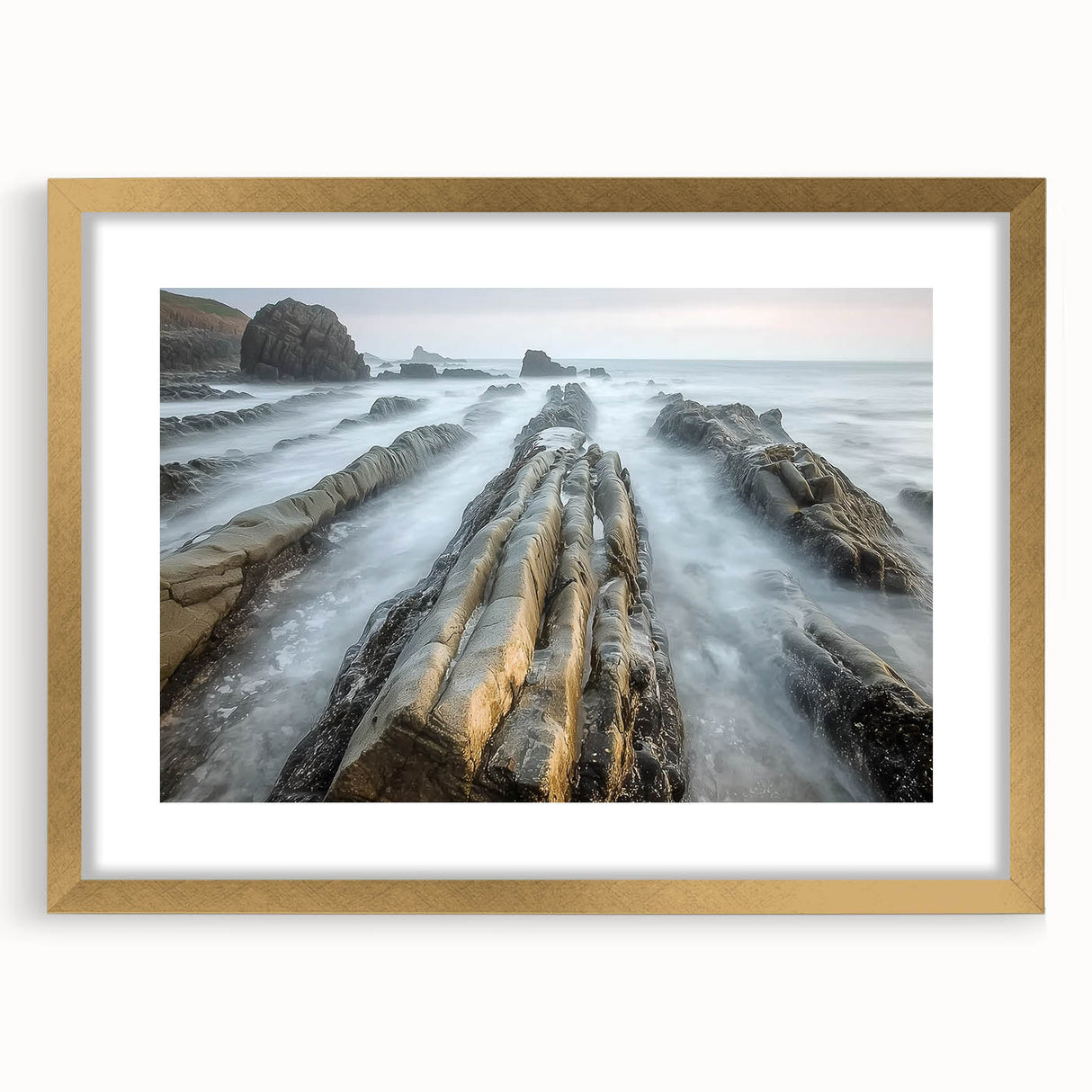 Framed landscape artwork depicting a serene beach scene with golden matting, ideal for home decor. Perfect for enhancing coastal-themed interiors.
