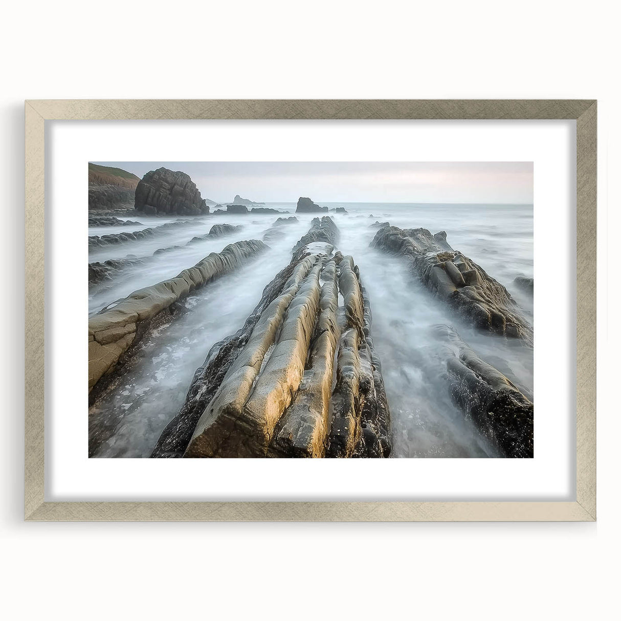 Landscape art print featuring serene beach scene framed in a sleek silver frame with a white mat, perfect for coastal-themed home decor.