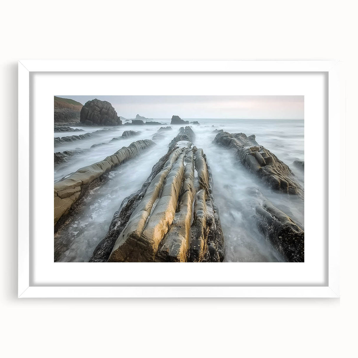 Landscape beach-themed artwork framed in a sleek white mat, showcasing vibrant colors of the ocean and sandy shores, perfect for coastal home decor.