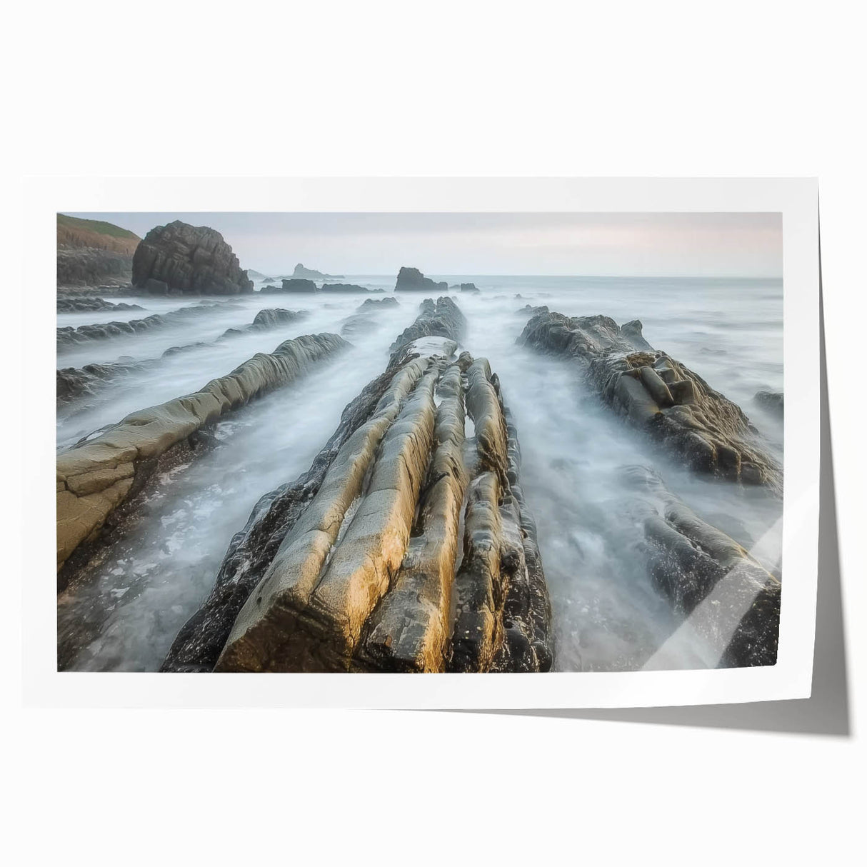 Stunning landscape canvas print showcasing a serene beach scene with gentle waves and a clear blue sky, rolled and ready for display in a protective cardboard tube.
