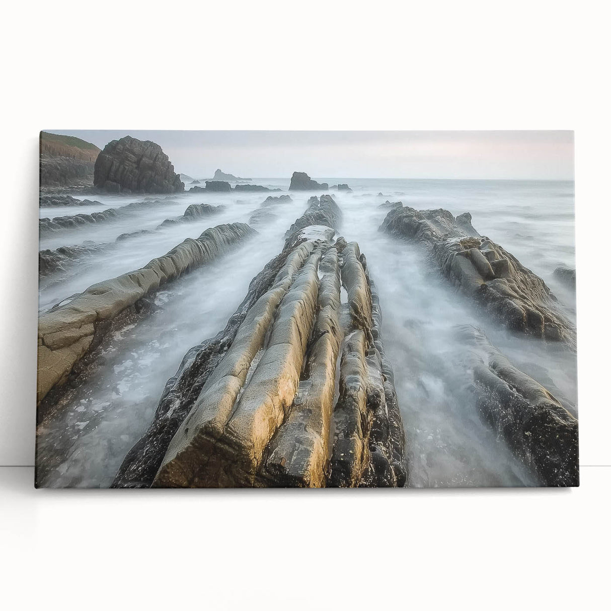 Stretched canvas artwork depicting a serene beach landscape with soft pastel colors, perfect for home decor, evoking tranquility and relaxation.