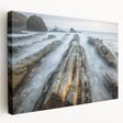 Stretched canvas artwork depicting a serene beach landscape with vibrant colors, showcasing gentle waves and a clear blue sky, perfect for home decor.