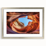 Framed landscape art print of canyons with a silver mat, showcasing vibrant colors and intricate details, perfect for enhancing home decor.