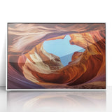 Framed acrylic artwork showcasing a vibrant landscape of canyons in rich earth tones, set in a sleek white frame, perfect for modern home decor. This captivating piece enhances any room with its natural beauty and artistic flair.