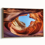 Framed canvas artwork showcasing a stunning landscape of canyons with rich earthy tones and a gold frame, perfect for enhancing home décor and adding a touch of elegance.
