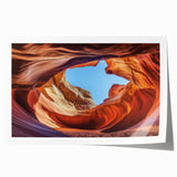 Landscape print showcasing vibrant canyons with rich earthy tones, rolled and ready for display, ideal for enhancing home decor or artistic spaces.