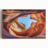 Stretched canvas artwork depicting a breathtaking landscape of canyons under a clear blue sky, showcasing vibrant colors and intricate details, perfect for home decor.