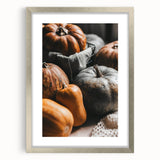 Textured abstract art print in warm autumn hues on a silver-framed canvas, suitable for bedroom art.