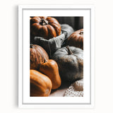 Abstract art print featuring swirling orange and brown tones on a white framed canvas, suitable for dining room decor.