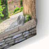 Close-up of an acrylic glass artwork showcasing a vibrant landscape with a majestic castle surrounded by lush greenery, enhancing any interior decor.