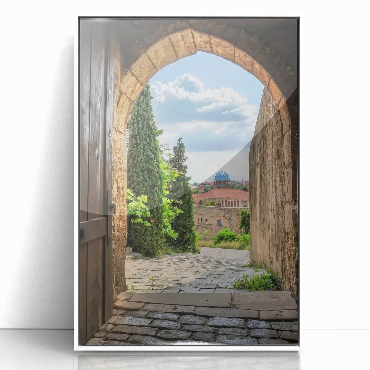 Framed acrylic artwork showcasing a picturesque landscape with a majestic castle, presented in a sleek white frame, ideal for enhancing home decor.