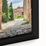 Close-up of a beautifully framed canvas artwork depicting a majestic castle landscape, showcasing vibrant colors and intricate details, perfect for home decor.