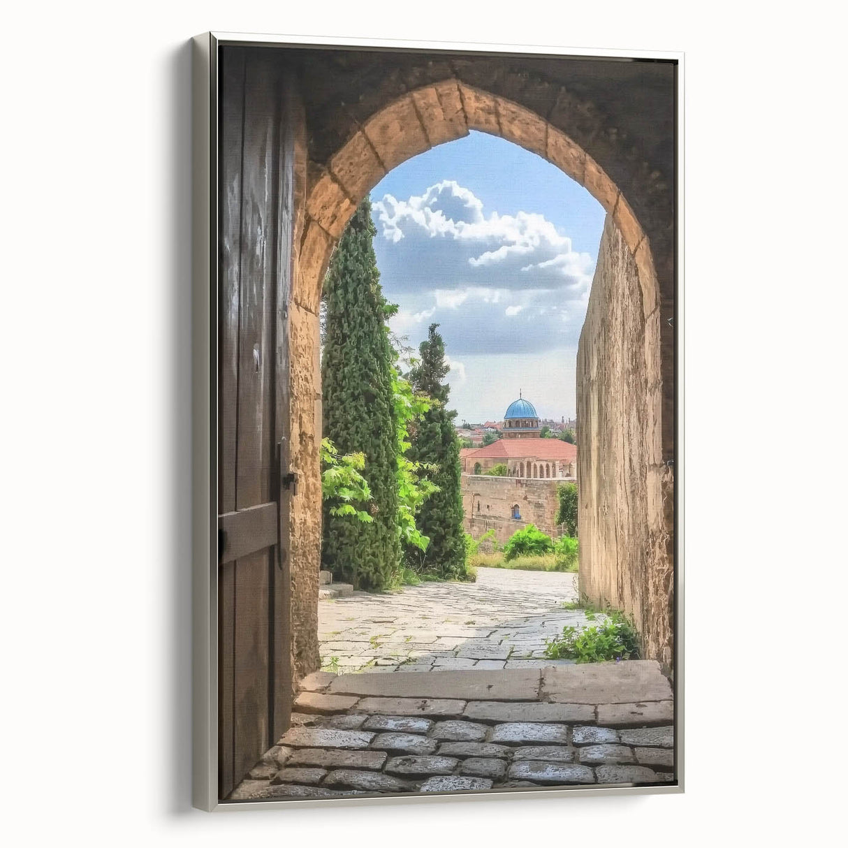 Framed canvas artwork depicting a majestic landscape with a castle, showcased from a silver side view. The piece features rich colors and intricate details, perfect for enhancing any room's decor.