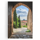 Stretched canvas artwork depicting a picturesque landscape with a medieval castle, vibrant colors, and lush greenery, perfect for home decor.