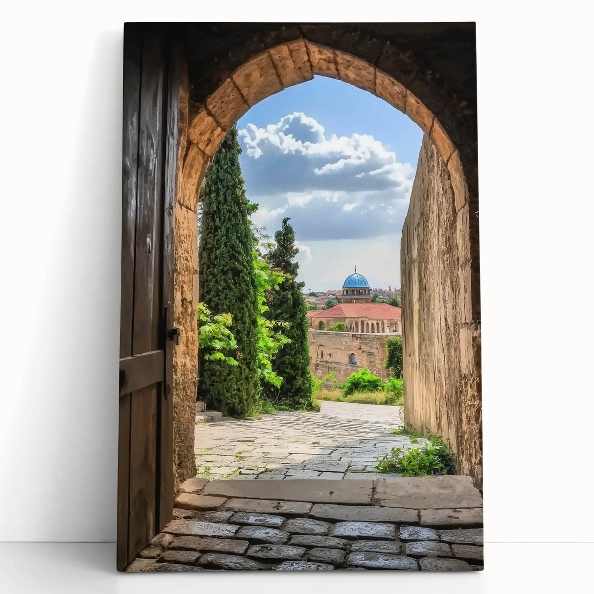 Stretched canvas artwork showcasing a picturesque landscape with a majestic castle surrounded by lush greenery, perfect for home decor or interior design.