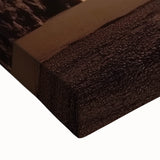Close-up of a stretched canvas artwork depicting vibrant landscapes and caves, showcasing intricate details and rich colors, perfect for home decor and art enthusiasts.
