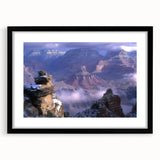 Black-framed landscape artwork showcasing vibrant canyons in rich earthy tones. The piece includes a white mat for added elegance, perfect for home decor.