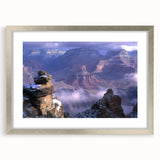 Framed landscape artwork depicting vibrant canyons in rich hues of orange and red, accented with a silver mat, ideal for enhancing modern home decor.