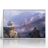 Framed acrylic landscape artwork showcasing vibrant canyons in warm earth tones, ideal for modern home decor. The piece is elegantly displayed in a white frame, enhancing its visual appeal and making it a striking addition to any living space.