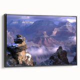 Framed canvas artwork depicting a stunning landscape of colorful canyons, showcasing vivid hues of red, orange, and blue, ideal for modern home décor.