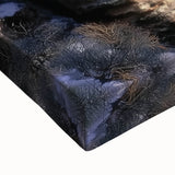 Close-up of a stretched canvas artwork depicting a vibrant landscape of canyons, showcasing rich earthy tones and intricate textures, perfect for home decor.