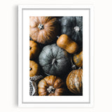 Abstract art print depicting autumn leaves in orange and red tones on a white framed canvas, suitable for dining room decor.