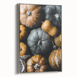 Framed canvas of a vintage landscape painting depicting autumn, with colorful foliage against a black background.