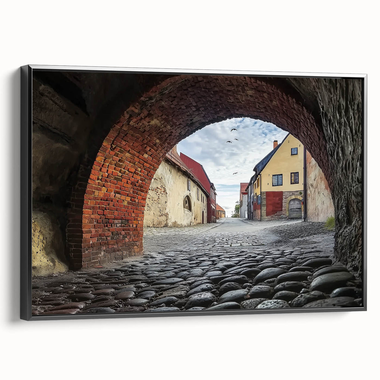 Framed canvas artwork showcasing a stunning landscape with a majestic castle set against a vibrant sky, presented in a sleek black frame, ideal for home decor.