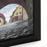 Close-up of a framed canvas artwork depicting a serene landscape with a castle, featuring vibrant colors and intricate details, perfect for home decor.