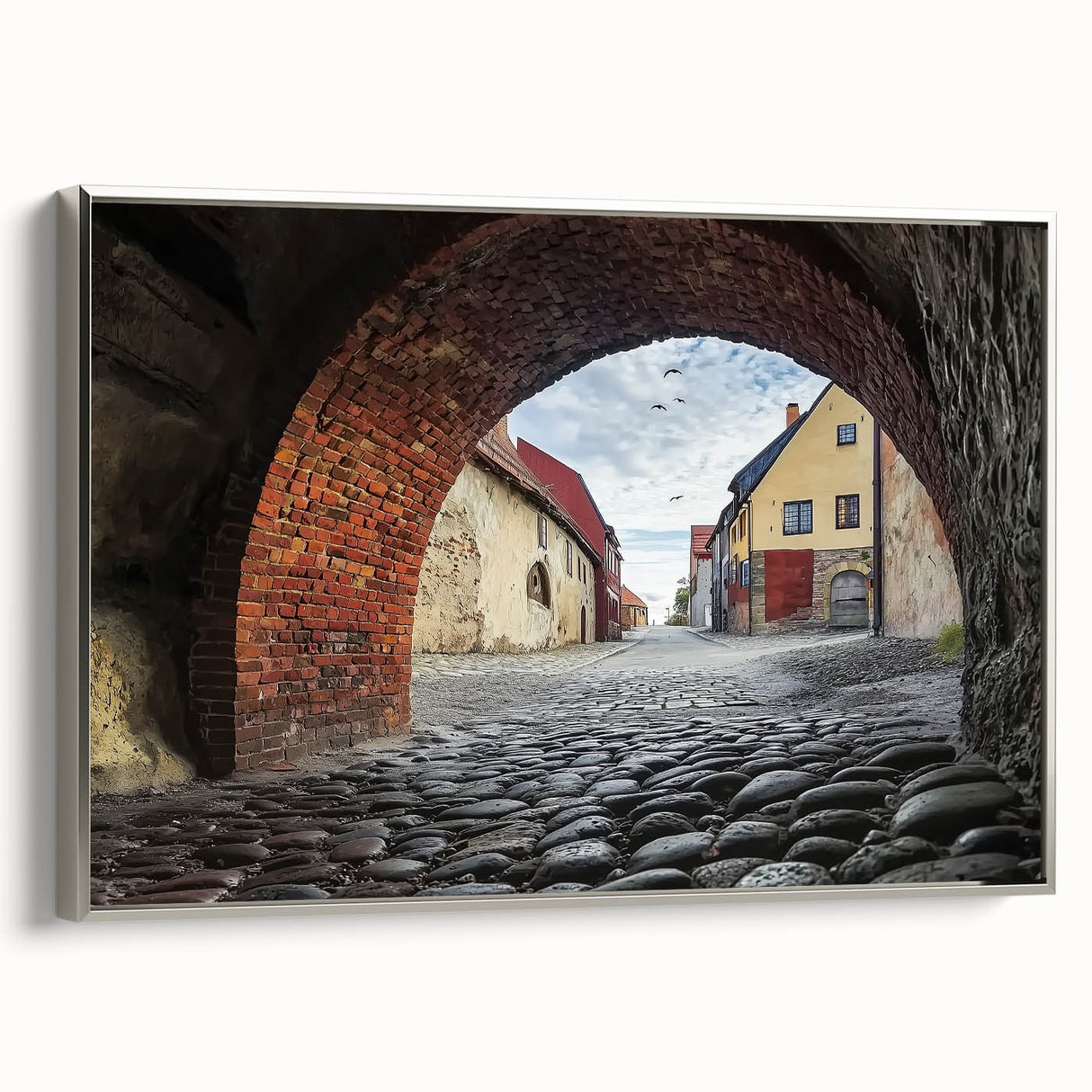 Framed canvas artwork depicting a serene landscape with a majestic castle, featuring a silver frame and showcasing intricate details and colors, perfect for home decor.