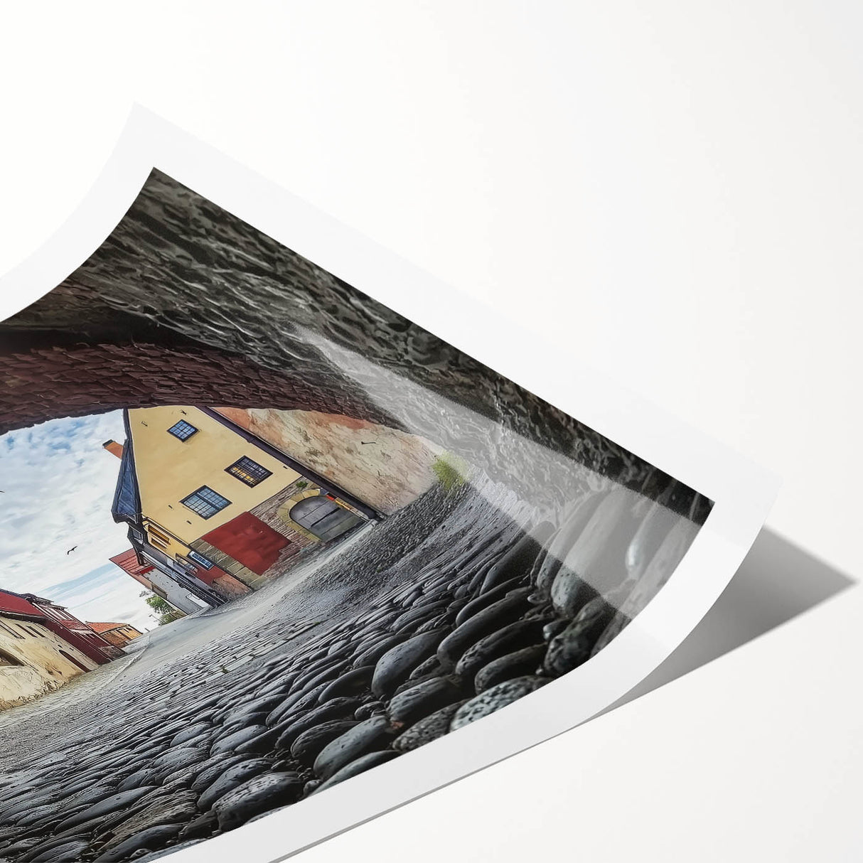 Rolled print showcasing a stunning landscape of a majestic castle surrounded by lush greenery and vibrant skies, designed for wall decoration and art enthusiasts.
