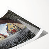 Rolled print showcasing a stunning landscape of a majestic castle surrounded by lush greenery and vibrant skies, designed for wall decoration and art enthusiasts.