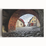 Stretched canvas artwork depicting a vibrant landscape featuring a majestic castle surrounded by lush greenery under a bright blue sky, perfect for home decor.